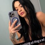 Rita Ora is unrecognisable in topless photo with long black hair