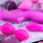 Collection of different types pink and violet of sex toys on violet background.Sex toy for adult dildo vibratorpink vaginal ballsclitoral stimulato Stock Photo